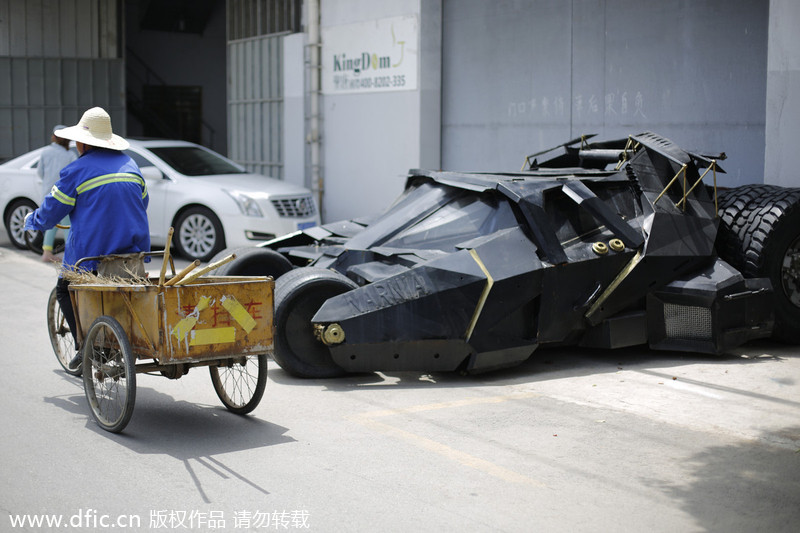 Batman fan opens door to his Batmobile