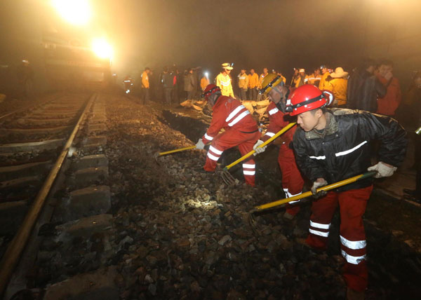 C China mudslide derails freight train