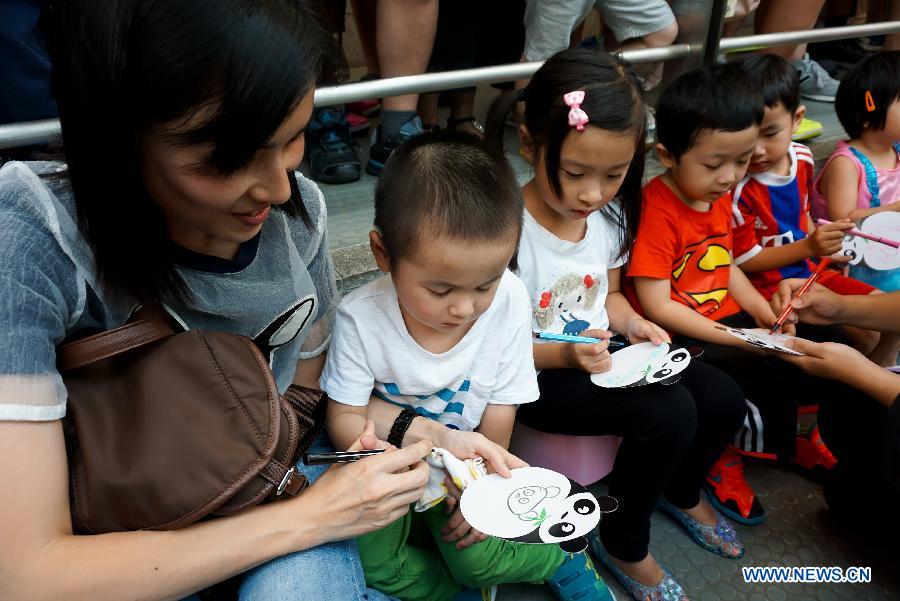 Children celebrate birthday of panda Kaikai in Macao