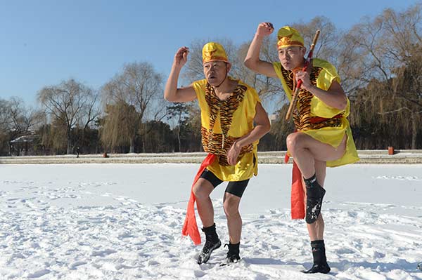 Winter swim enthusiasts celebrate the Year of the Monkey