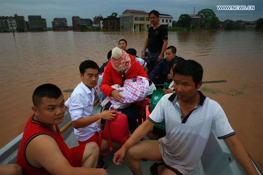 13 dead, 13 missing in China rain, landslides