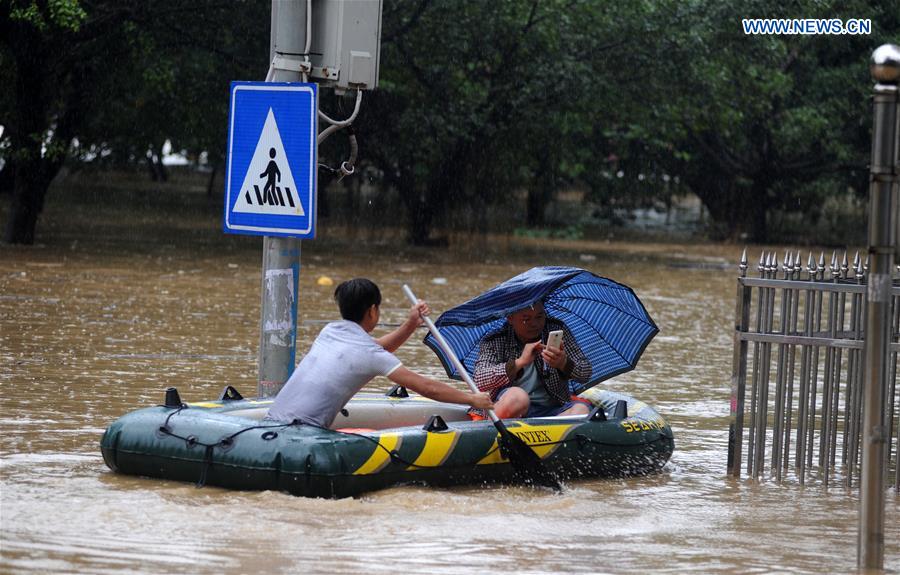 13 dead, 13 missing in China rain, landslides