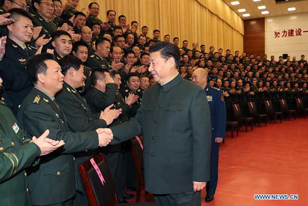 Xi urges continued efforts to build strong military