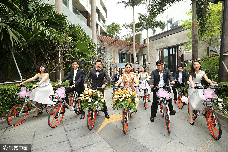 Sharing is caring: Newlyweds take bike-sharing ride