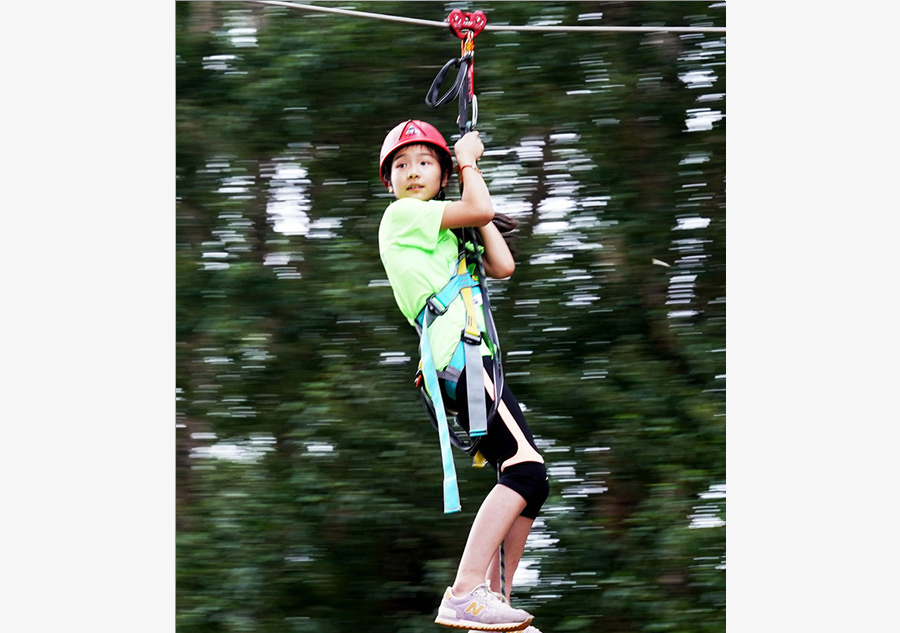 Children test survival skills in woods and on water