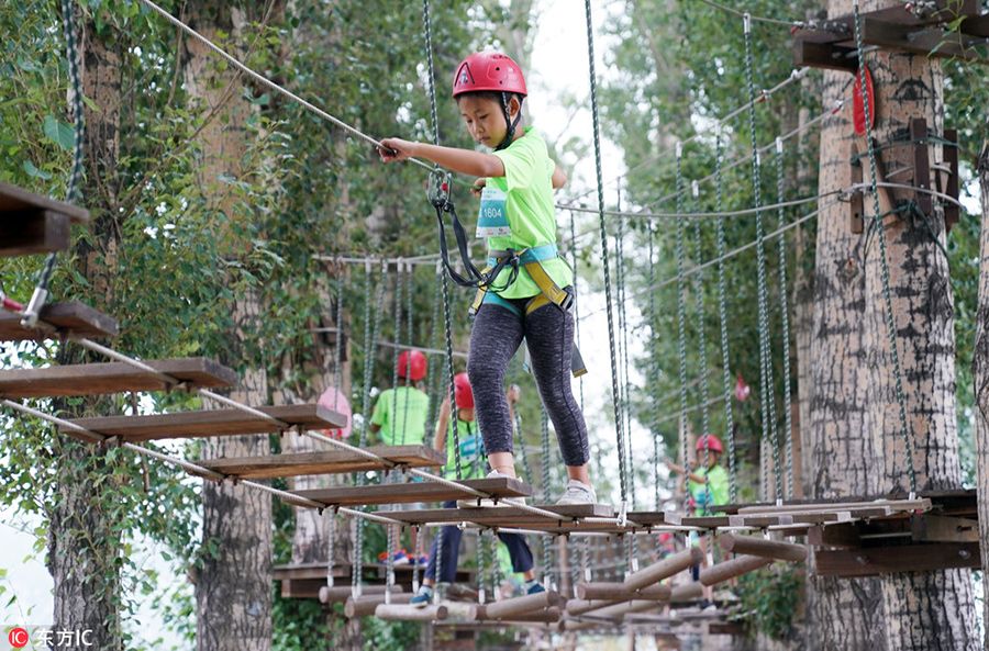 Children test survival skills in woods and on water