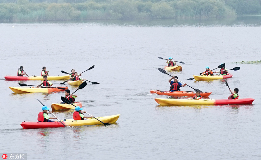 Children test survival skills in woods and on water