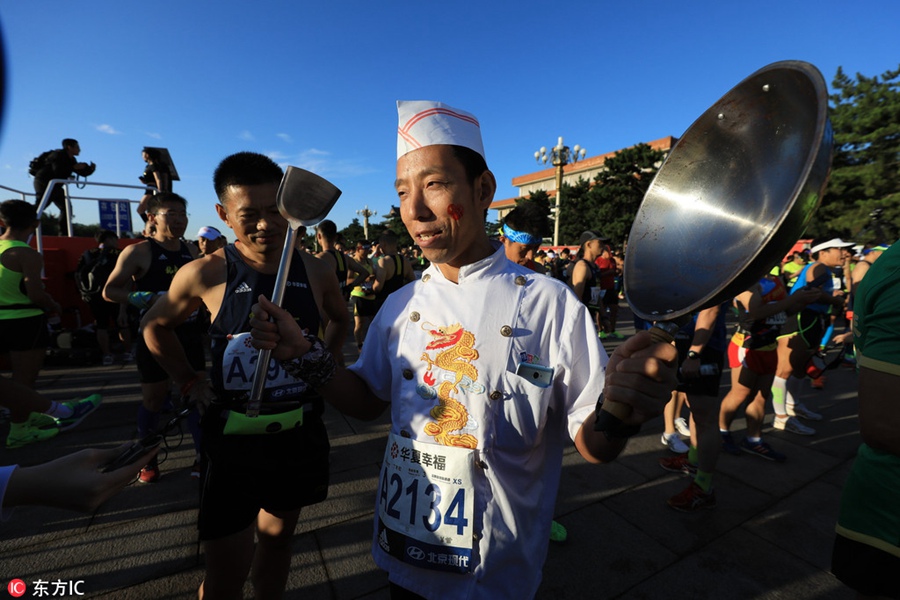 Runners compete during 2017 Beijing Marathon