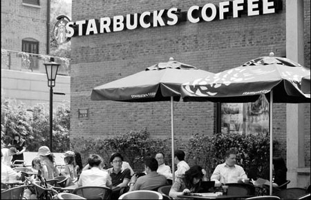 Starbucks buys back control of stores