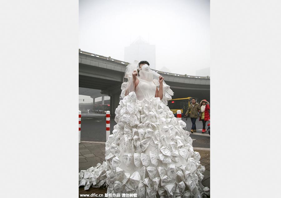 Artist appeals to public to combat smog with respirator wedding dress