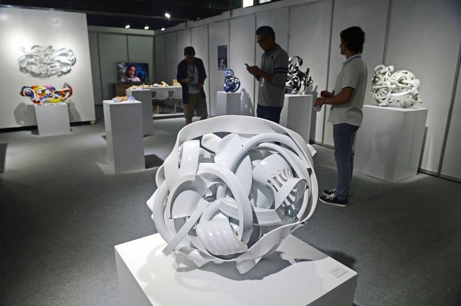 Visitors view ceramic craftworks in China Jingdezhen Int'l Ceramic Fair