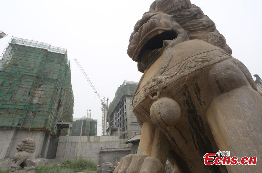 1,800-year-old temple under siege from high buildings in C China