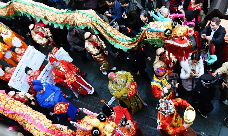 People welcome 'God of Wealth' to mark Spring Festival