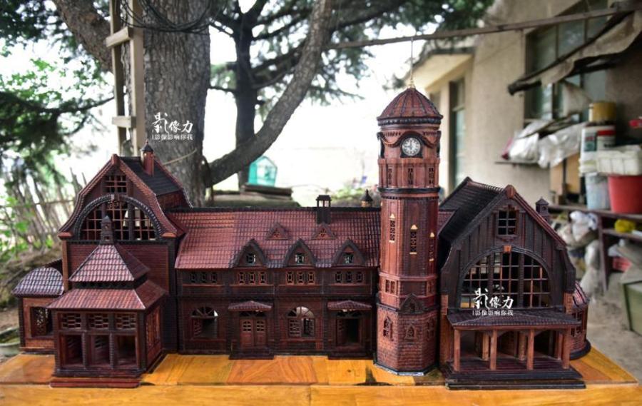 Retiree spends nearly three years carving iconic railway station