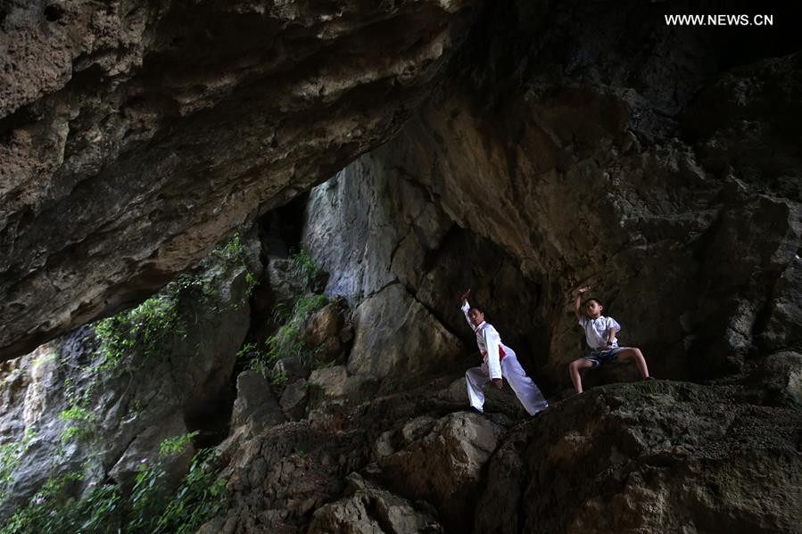 Children learn about Chinese Wushu during summer vacation in SW China