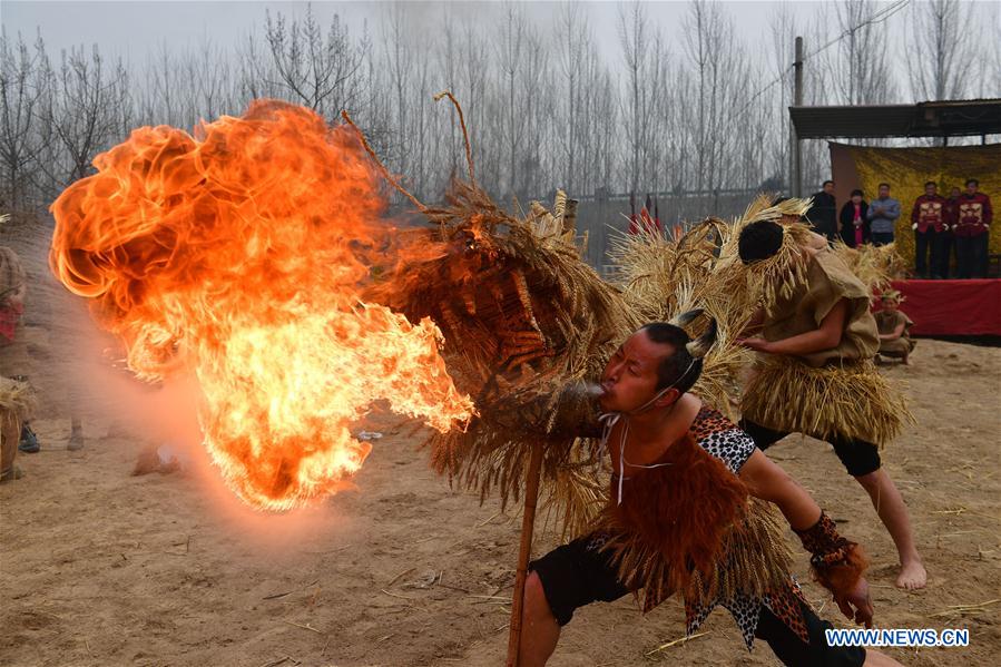 Folk art: dance of straw dragon in China's Henan