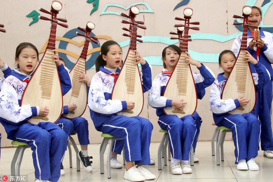 Students perform traditional Pingtan opera in Suzhou