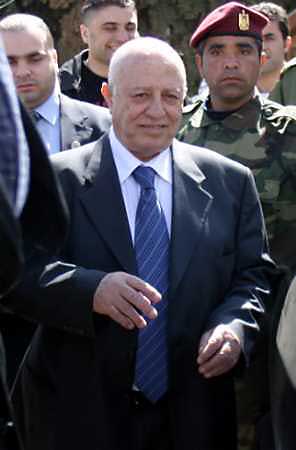 Palestinian Prime Minister Ahmed Qurie smiles after a meeting with the Palestinian Legislative Council in the West Bank city of Ramallah February 22, 2005. Qurie agreed to revamp his cabinet with more reform-minded ministers and present the new government to parliament on Wednesday, defusing a political crisis. (Loay Abu Haykel/Reuters) 