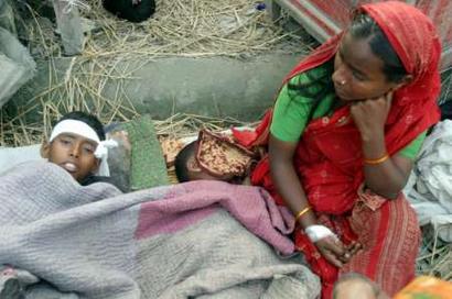 A Bangladeshi 
 mother takes care of her children injured in a storm in the district of Gaibandha, about 300km (200 miles) from the capital Dhaka, March 21,2005. At least 37 people were killed and 1,000 injured in the violent tropical storm that whipped through northern Bangladesh on Sunday night.[Reuters]