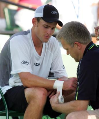 ATP official Per Bastholt raps Andy Roddick (news) wrist during the second sets against Fernando Verdasco (news) of Spain at the Nasdaq 100 Open in Key Biscayne, Fla., Friday, March 25, 2005. Roddick retired from the match 7-6, 4-3 with a wrist injury. (AP Photo/Luis M. Alvarez)