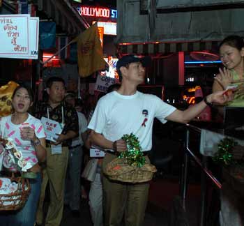 Chinese stars hand out free condoms in Thai red light area