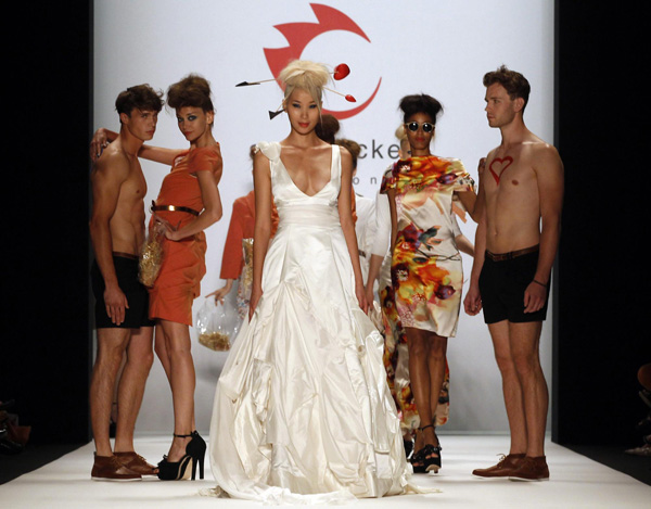 Models present creation at Berlin Fashion Week Spring/Summer 2012