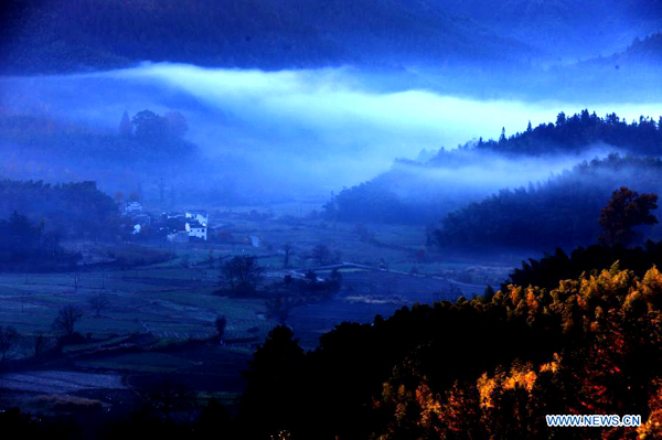 Fog-covered countryside residences in Huangshan