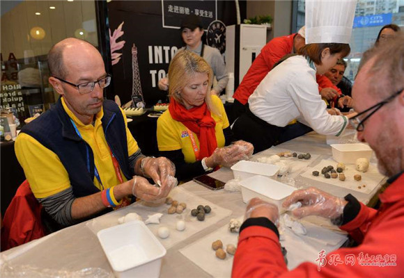 Clipper Race Qingdao crew members make glutinous rice balls