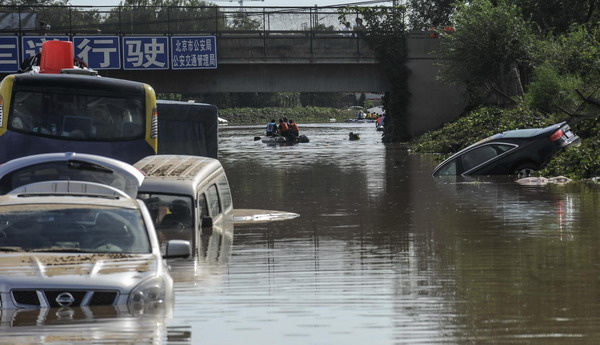 Deadly storm leaves 15,000 cars damaged