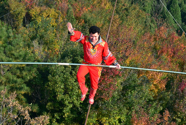 Tightrope walker Adili walks above the Great Wall