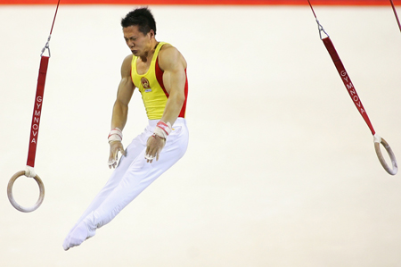 Chinese add three golds to double haul at gymnastics worlds