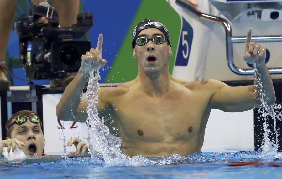 Phelps adds Olympic gold medal haul to historic 21