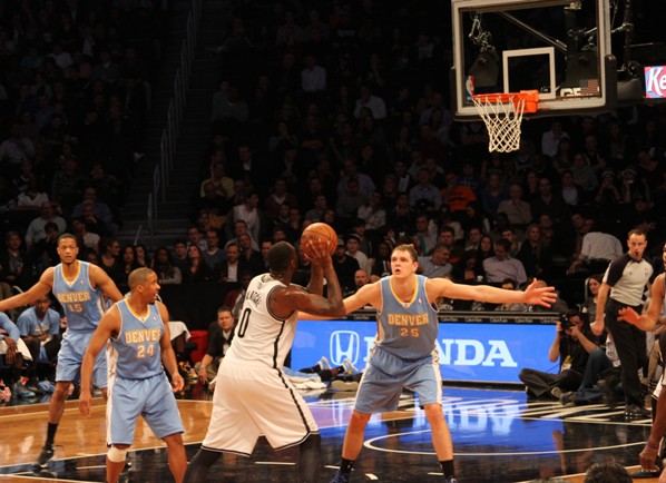 Nets knocked down by Nuggets, home boos