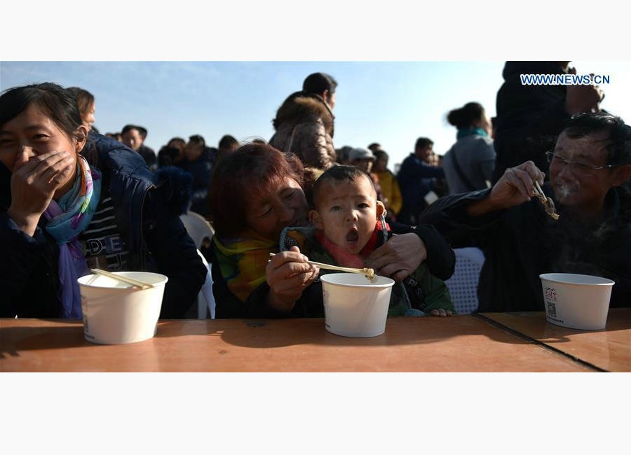 Cooks make lamb stew during food festival