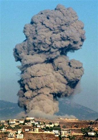 A large plume of smoke billows in the town of Khiam, in southern Lebanon, Tuesday, July 25, 2006, after Israeli air raids targeted it. An Israeli air raid on south Lebanon killed as many as four UN observers, overshadowing an international crisis meeting due to open in Rome, as Hezbollah vowed to fire rockets further into the heart of Israel.[AP Photo]