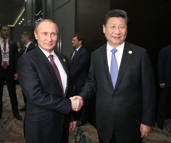 Xi, Putin meet at G20 summit, renewing pledges on cooperation