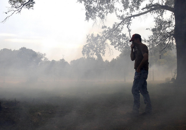 2 dead in Texas wildfires, homes destroyed