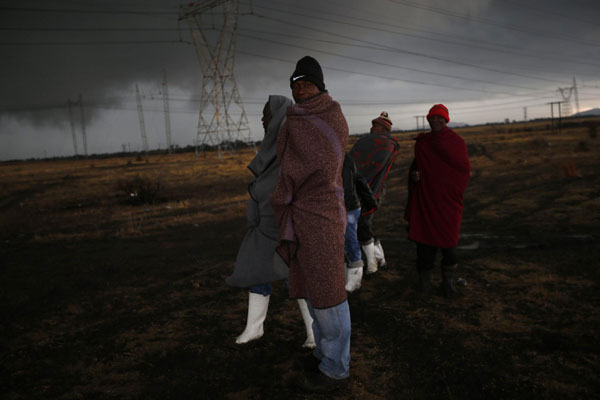 S. African miners march outside Marikana mine