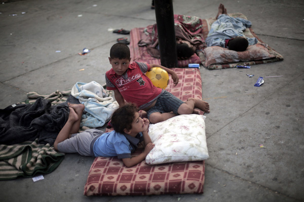 Palestinian children celebrate Eid al-Fitr in refuge camp