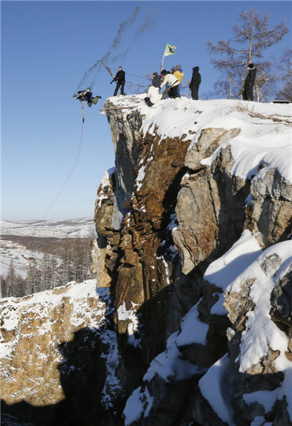 Rope-jumpers pictured leaping into crater