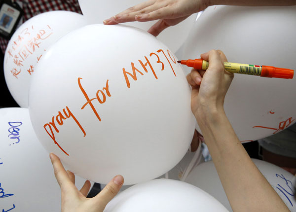 MH370 families remember one year on