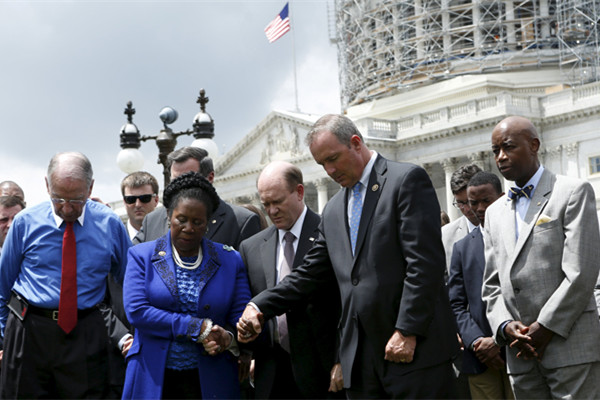 Obama says church shooting shows need for reckoning on guns