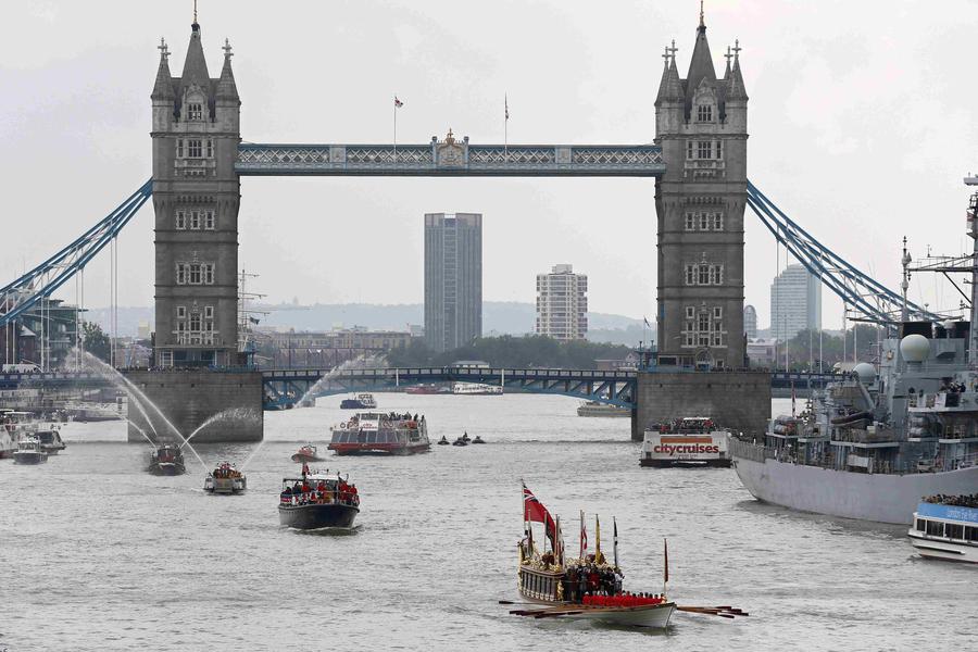 Flotilla sails down Thames to mark Queen's long reign