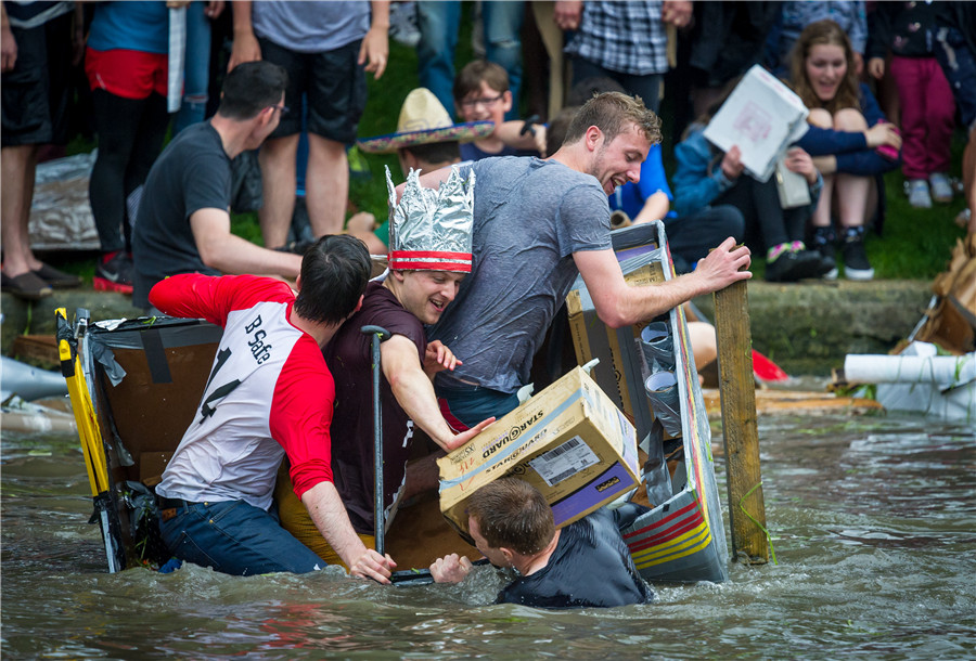 Cambridge students celebrate end of exams with cardboard boat race