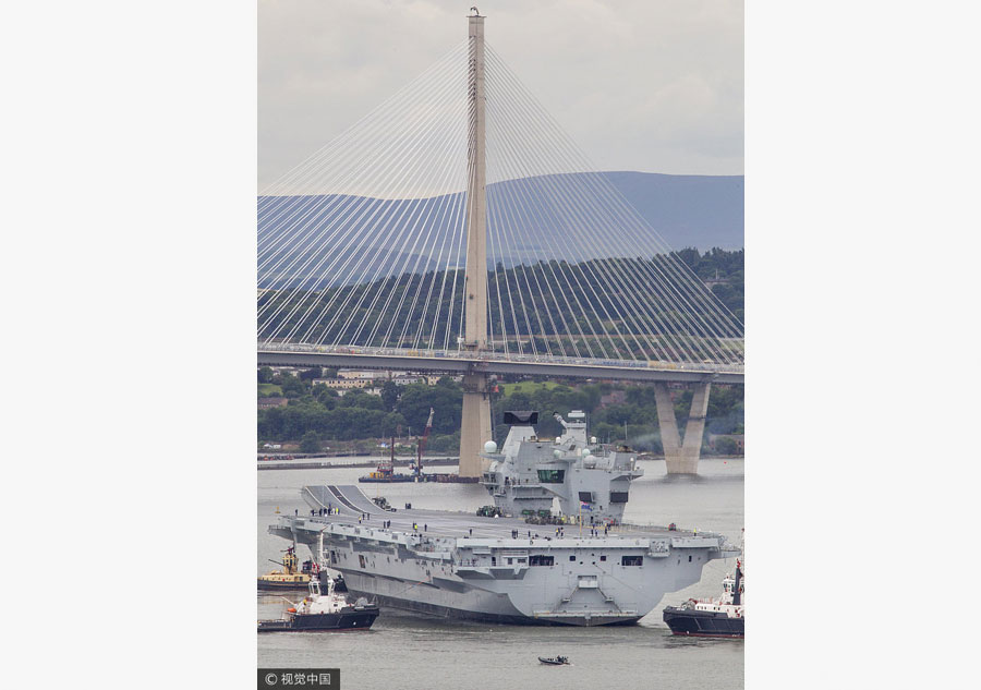 Royal Navy's biggest ever warship finally heads for high seas for trials